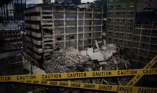 Heavy machinery clearing debris at the collapsed 18-storey building in Eastleigh, Nairobi.